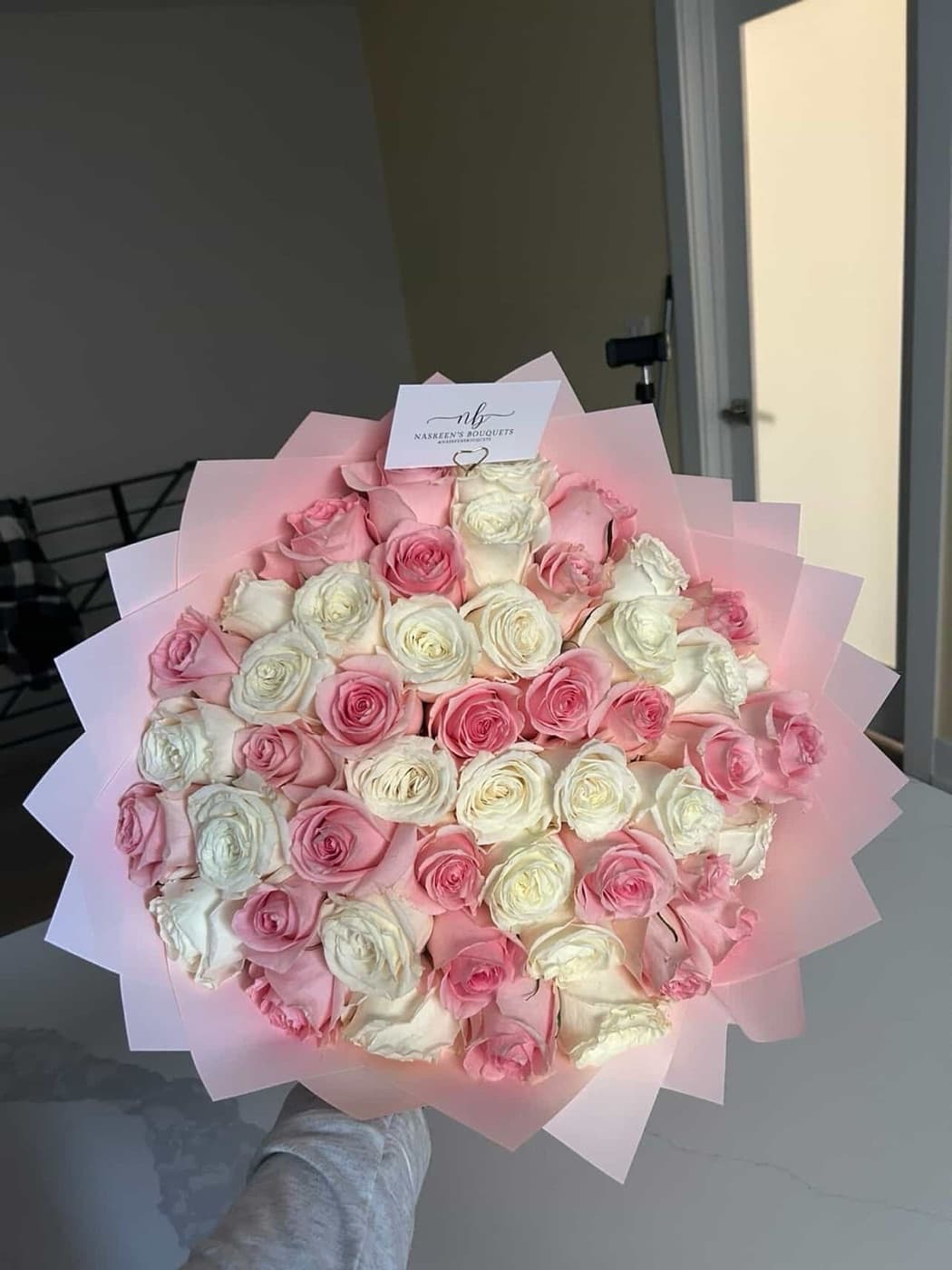 Pink and white roses in blush wrap